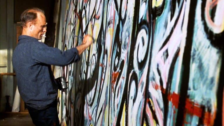 ‘Pollock’ Blu-Ray Review – Ed Harris Puts His Soul Into The Life Of The Famous Painter A man painting a wall.