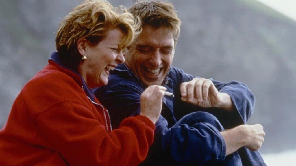 A man and woman laughing.