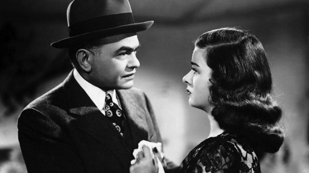 A man and woman looking at each other.