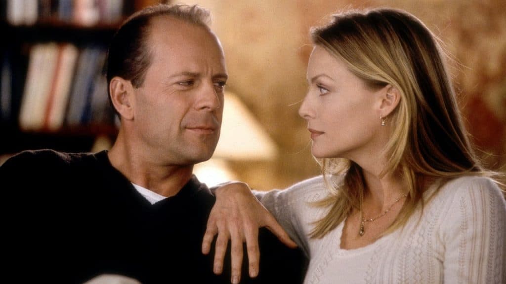 A man and woman sitting next to each other.