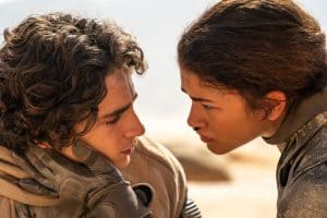 A man and woman looking at each other.