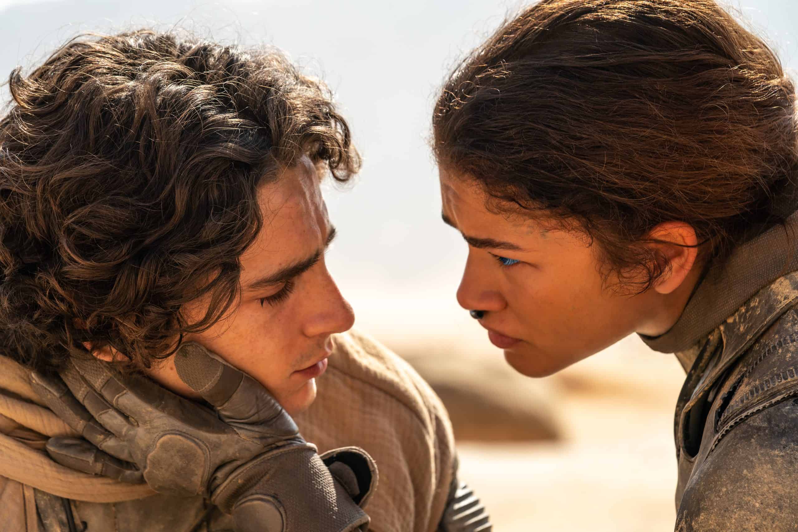 A man and woman looking at each other.