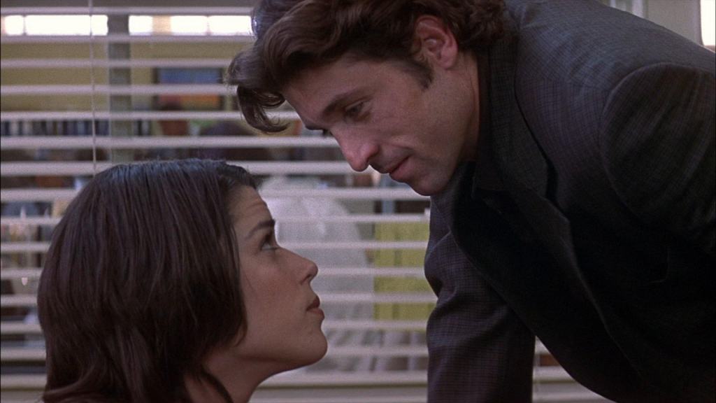 Two individuals engaged in an intense gaze.