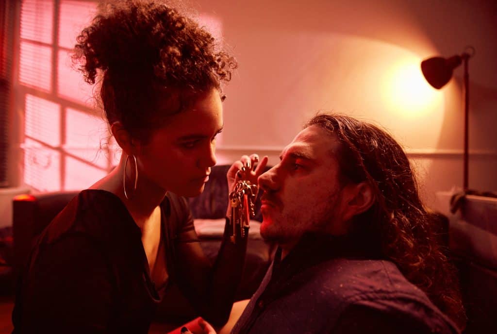 A man with long hair and a woman with long hair.