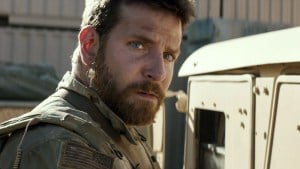 ‘American Sniper’ 4K UHD Blu-Ray Review – The Psychological Burden Of War A bearded man in military attire looking intently to the side.
