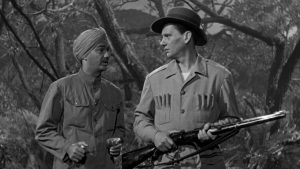 Two men in military uniforms standing next to each other.