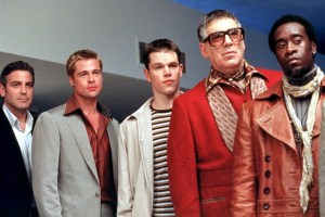 The Ocean’s Trilogy 4K UHD Blu-Ray Review – Heist Films Are Rarely More Fun Five men posing with varied expressions, dressed in a mix of casual and flamboyant attire, standing side by side.