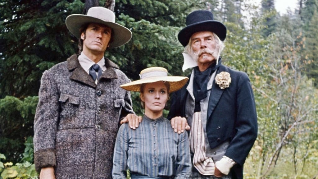 Three actors dressed in period costumes standing outdoors, portraying characters from a historical drama.