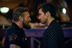 Two men looking at each other.