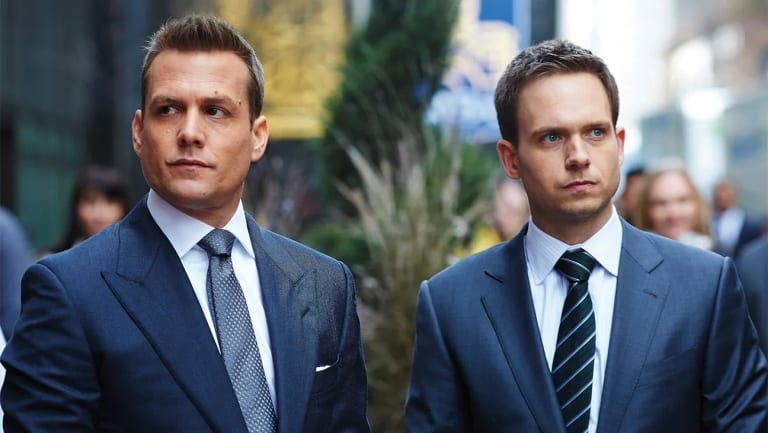 ‘Suits’: The Complete Series Blu-Ray Review – Breezy Legal Drama Is Terrific Fun Two businessmen in suits walking with serious expressions.