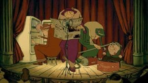 ‘The Triplets Of Belleville’ Blu-Ray Review – A Quirky Animated Gem That Embraces The Medium A group of people sitting on a stage reading a newspaper.