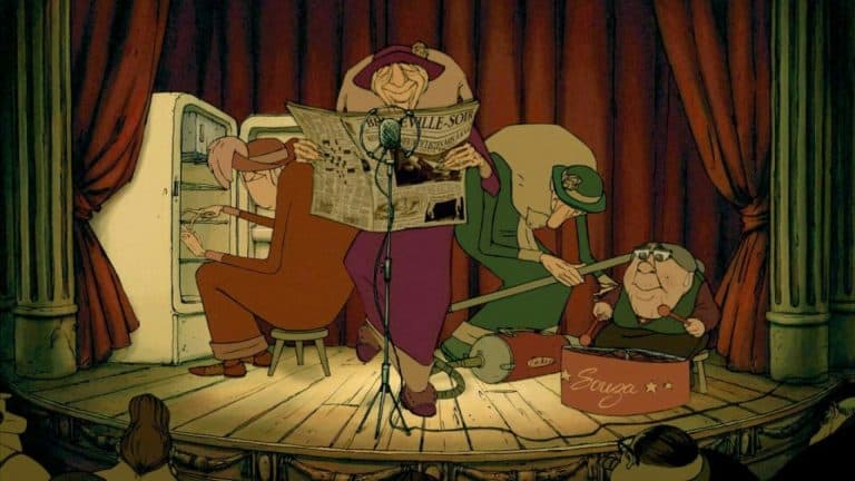 A group of people sitting on a stage reading a newspaper.
