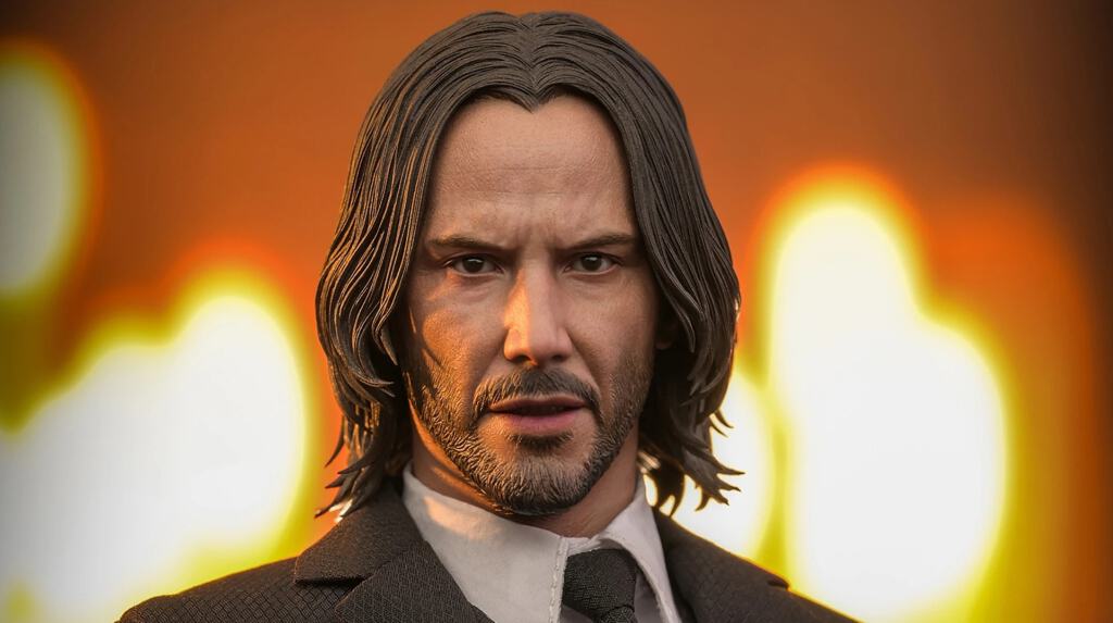 A close-up of a keanu reeves figurine with a sunset backdrop.
