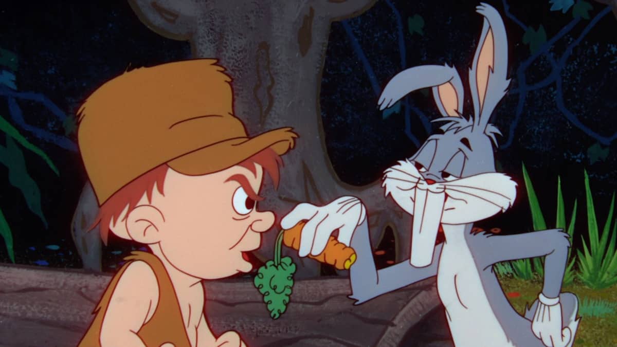 A cartoon boy looks skeptically at a carrot offered by bugs bunny.