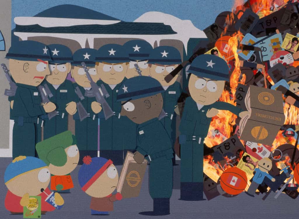 Illustration from "south park" showing characters in front of burning books, with police in riot gear observing.