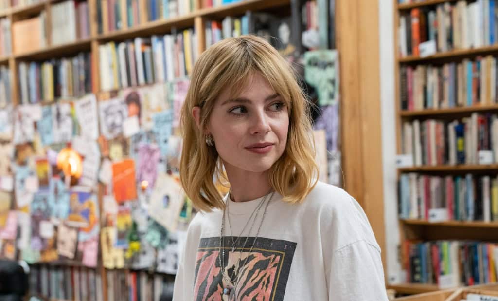 A woman browsing in a bookshop.