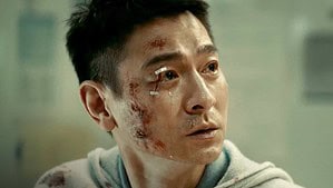 Imprint Asia Announces July Titles Including Works From Jet Li, Zhang Ziyi, Andy Lau & More A man with a bruised and bloodied face looks off to the side, his expression filled with concern and distress.
