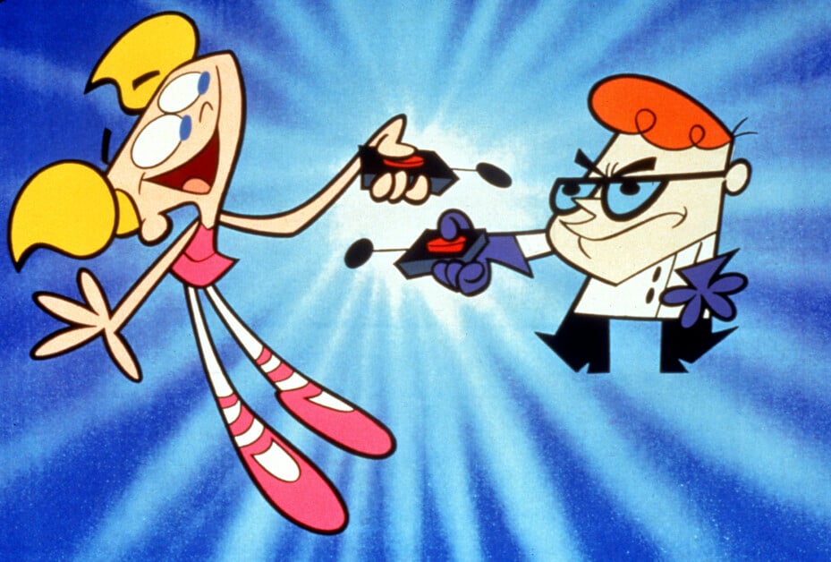 A blonde girl in a pink outfit and a boy with glasses in a lab coat holding remote controls, standing against a blue background with a burst pattern.