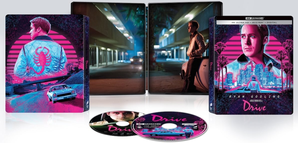 Blu-ray set of the movie "Drive" featuring a steelbook case with neon artwork, two discs, and an image of the main character in a white jacket with a scorpion symbol.