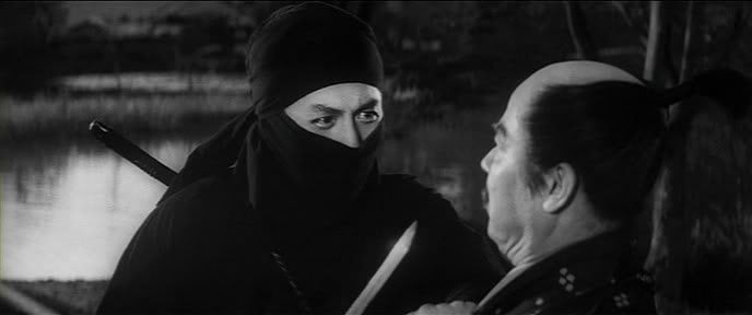 A ninja in a black mask, with eyes glaring intensely, confronting an older man in traditional attire holding a sword.