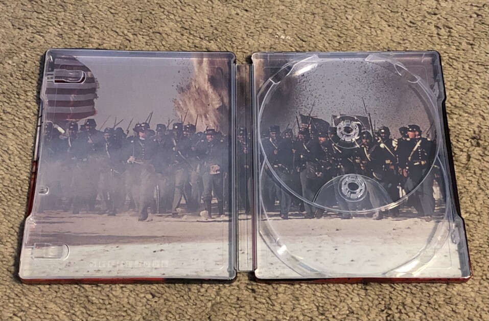 Open DVD case showing an image of soldiers in historical uniforms, with space for two discs inside.