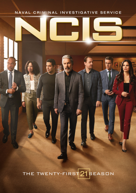 Promotional poster for the twenty-first season of NCIS, featuring a group of seven formally dressed individuals walking forward, with the show's title at the top and season details at the bottom.
