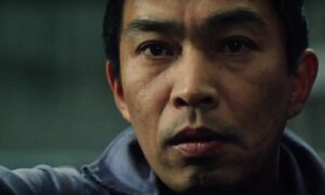 ‘Eighteen Years In Prison’ Blu-Ray Review – Japanese Incarceration Drama Sears With Moral Ambiguity Close-up of a person's face with a serious expression, looking slightly to the side.