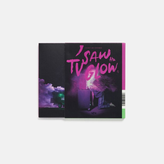 Colorful book titled "I Saw the TV Glow" with a person standing in front of a glowing television and a backdrop of smoke and a green object. The cover features purple and pink hues.