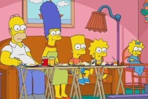 Animated family sitting on a sofa eating dinner on tray tables. From left to right: a bald man, a blue-haired woman, a yellow-haired boy, a yellow-haired girl, and a baby with a bow in her hair.
