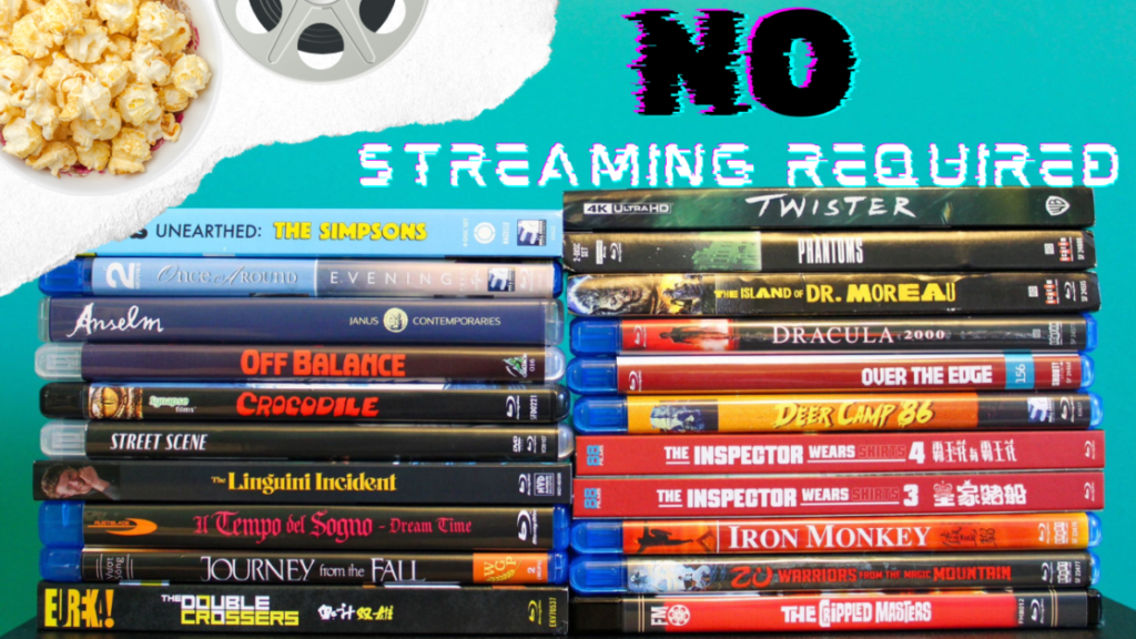 Stack of various DVD and Blu-ray movie cases next to a bowl of popcorn and a film reel, with the text "No Streaming Required" at the top.