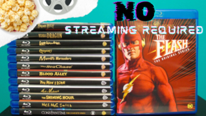 A stack of Blu-ray discs next to a Blu-ray case for "The Flash: The Complete Series" with a text overlay that reads "NO STREAMING REQUIRED." Popcorn and a film reel are in the top left corner.