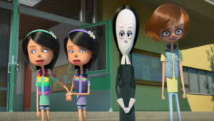 ‘The Addams Family 1 & 2’ Double Feature 4K UHD Blu-Ray Review – Family-Friendly Spooky Times Four animated characters stand in front of a building. Two identical girls in colorful outfits hold hands, a tall girl with pale skin and a black dress stands in the center, and a boy with a surprised expression is on the right.