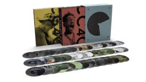 A box set containing numerous CDs arranged in three rows. The box features artistic designs and images of people on both sides.