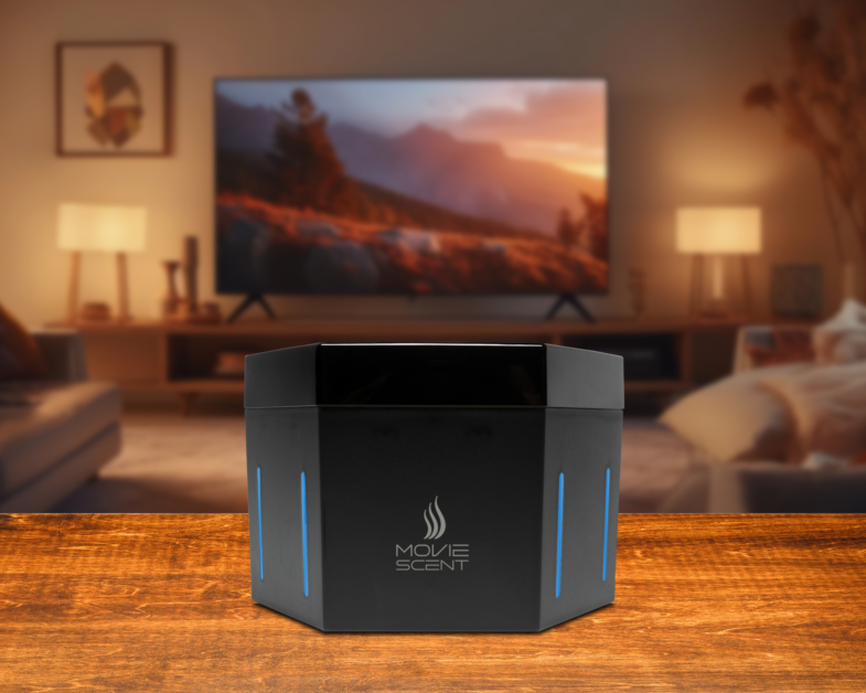 A black, hexagonal device with blue lights labeled "Move Scent" is on a wooden table. In the background, a living room with a TV showing a landscape scene is visible.