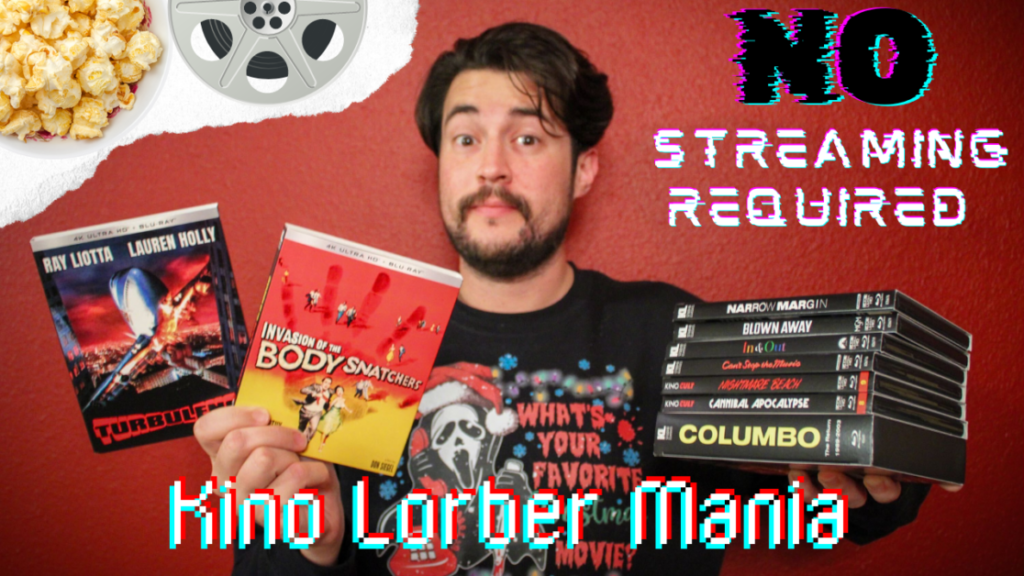 A man stands holding multiple DVDs in front of a red wall with movie posters, a popcorn bowl, and text that reads "NO STREAMING REQUIRED" and "Kino Lorber Mania.