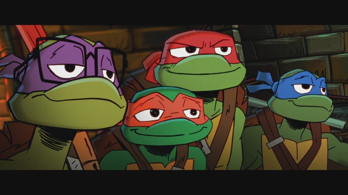 Four animated anthropomorphic turtles wearing different colored masks are standing together, looking intently. They are dressed in ninja attire and are set against a dimly lit background.