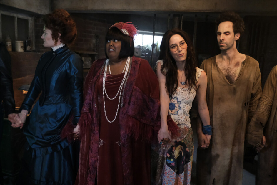 “Patience” – While Sam and the ghosts race to find him, Isaac comes face to face with Puritan ghost Patience (Mary Holland) for the first time since she was lost in the dirt, on the fourth season premiere of the CBS Original series GHOSTS, Thursday, Oct. 17 (8:30-9:00 PM, ET/PT) on the CBS Television Network, and streaming on Paramount+ (live and on demand for Paramount+ with SHOWTIME subscribers, or on demand for Paramount+ Essential subscribers the day after the episode airs)*. Pictured (L-R): Utkarsh Ambudkar as Jay, Rose McIver as Samantha, Devan Chandler Long as Thorfinn, and Asher Grodman as Trevor. Photo: Bertrand Calmeau/CBS ©2024 CBS Broadcasting, Inc. All Rights Reserved.