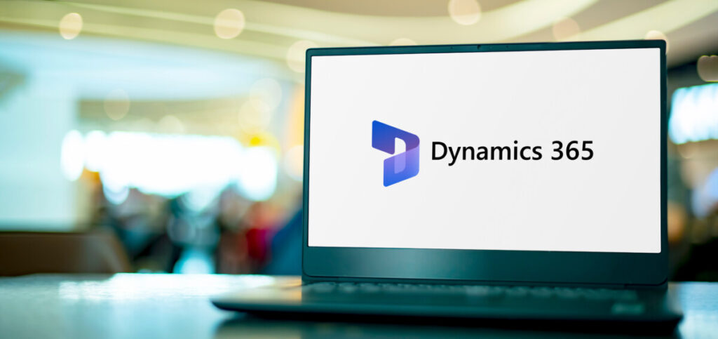 Laptop computer displaying logo of Microsoft Dynamics 365, a product line of enterprise resource planning and customer relationship management intelligent business apps