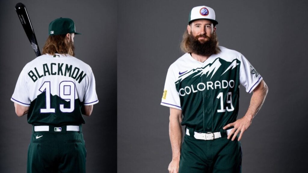 Baseball player in a "Colorado" jersey and cap stands with bat. Jersey number 19 with name "Blackmon" on the back.