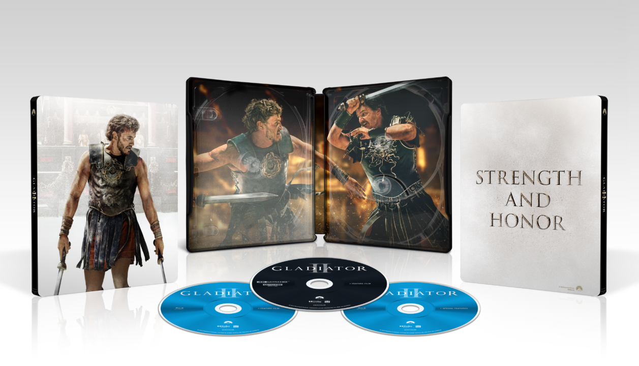 A "Gladiator" collector's edition set with a case featuring movie scenes, three Blu-ray discs, and the phrase "Strength and Honor" on the inner cover.