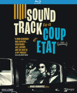 Blu-ray cover for "Soundtrack to a Coup d'Etat" featuring a black-and-white photo of three people in a car, with text including reviews and film festival awards.