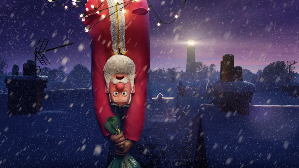Santa Claus hanging upside down while holding a green sack in a snowy, nighttime scene with a lighthouse in the background.