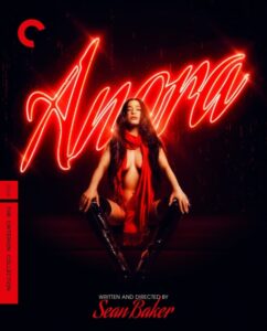 A person poses seated under a red neon sign reading "Amora." They wear thigh-high black boots and a red scarf. The words "Written and Directed by Sean Baker" are at the bottom.