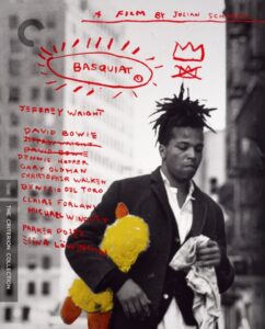 A man stands on a street holding a bag, with handwritten text and sketches overlaid, including the name "Basquiat" and a crown symbol. Names of actors are listed on the left.