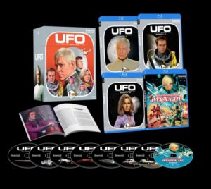 Box set of UFO series DVDs with multiple disc cases, featuring character images on the covers, a booklet, and several discs.