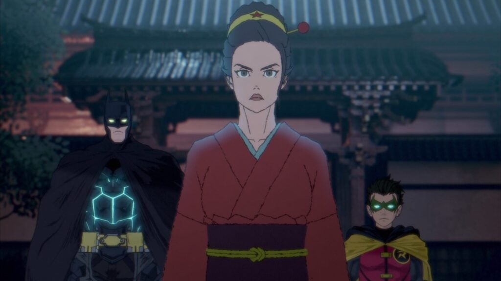 A woman in traditional attire stands in front of two individuals in superhero costumes, with a building in the background.