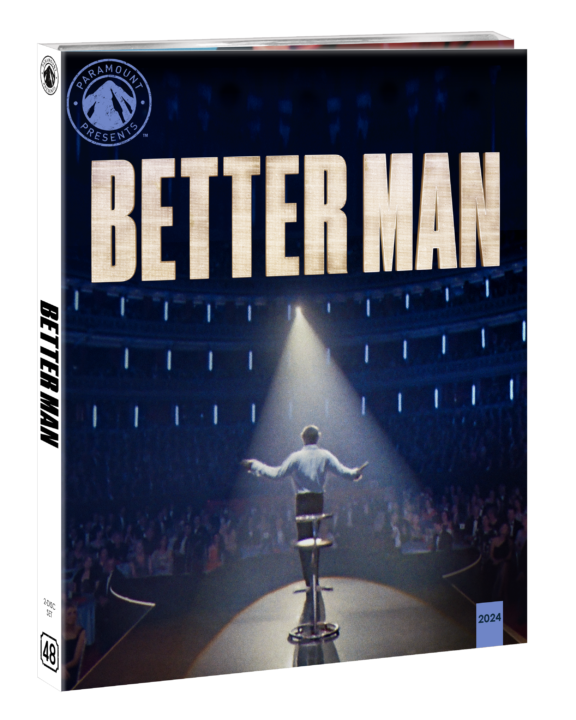 A person stands on a stage with arms outstretched, facing an audience. The image is a DVD cover for the movie titled "Better Man.