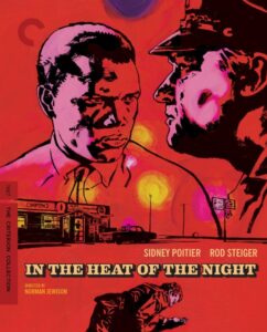 Illustrated movie poster featuring two men facing each other with a neon-lit diner in the background. Text reads "In the Heat of the Night," names of actors, and director. Criterion Collection label.