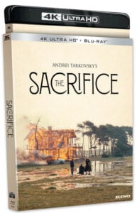 4K Ultra HD and Blu-ray cover of "The Sacrifice" by Andrei Tarkovsky, featuring a burning house near water and trees, with three people and a bicycle in the foreground.