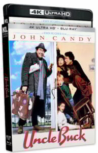 Cover of "Uncle Buck" 4K Ultra HD and Blu-ray, featuring a man at a door with a suitcase, greeted by surprised family members indoors.